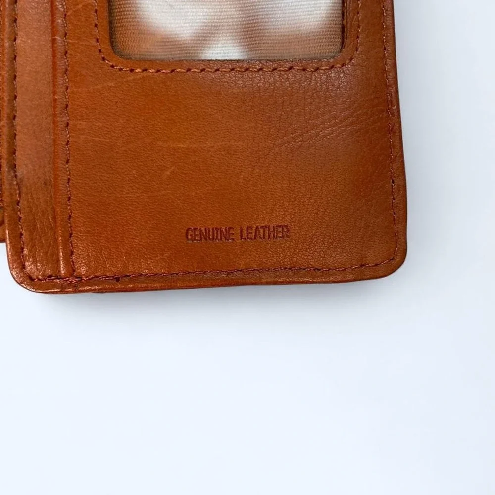 Brown leather wallet with multiple card slots‎ and a zippered compartment